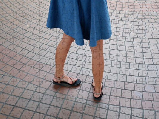 Woman in Blue Dress on Tiled Floor - Puzzle