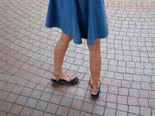 Woman in Blue Dress on Tiled Floor - Puzzle