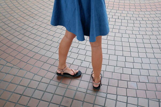 Woman in Blue Dress on Tiled Floor - Art Print